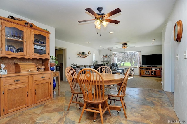 dining room featuring ceiling fan and light tile flooring