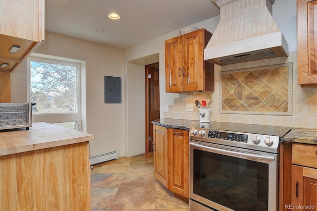 kitchen with backsplash, baseboard heating, stainless steel electric range oven, and custom range hood