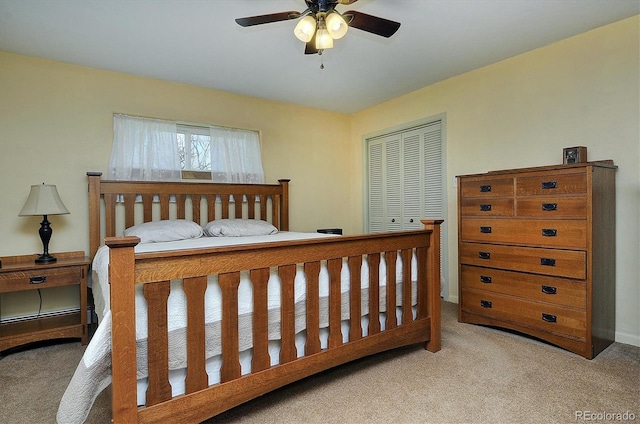 bedroom featuring carpet, ceiling fan, and a closet