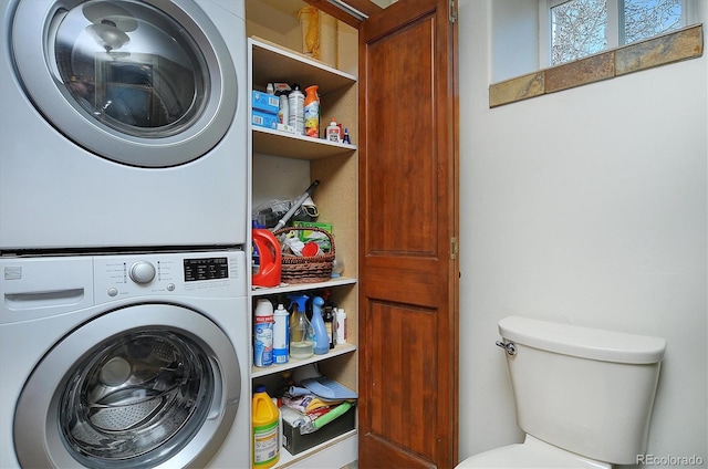 washroom featuring stacked washer and dryer