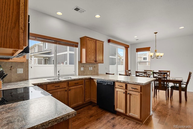 20826 Robins Dr, Denver, CO 80249 - kitchen featuring dishwasher, a peninsula, tasteful backsplash, dark wood-style flooring, and recessed lighting
