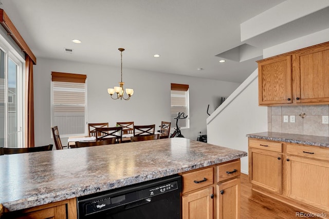 20826 Robins Dr, Denver, CO 80249 - kitchen with black dishwasher, tasteful backsplash, light wood finished floors, a chandelier, and recessed lighting