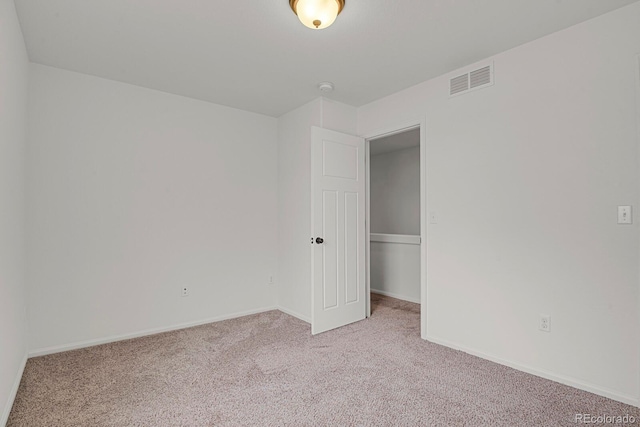 20826 Robins Dr, Denver, CO 80249 - unfurnished bedroom with light carpet and baseboards