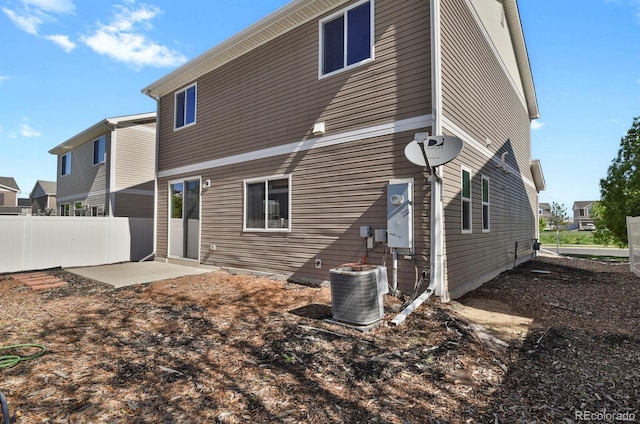 20826 Robins Dr, Denver, CO 80249 - back of property featuring fence, central AC, and a patio