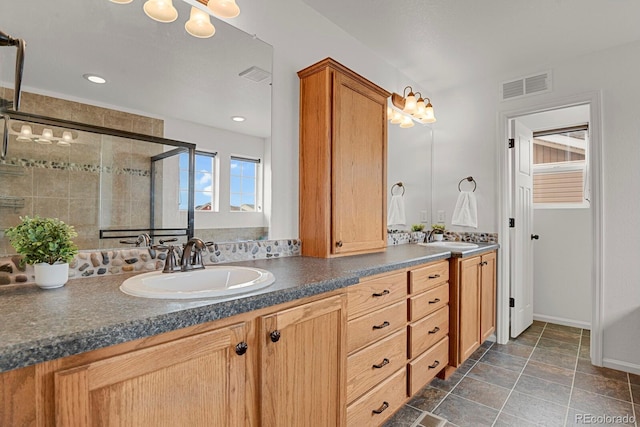 20826 Robins Dr, Denver, CO 80249 - full bathroom with a stall shower, double vanity, and baseboards