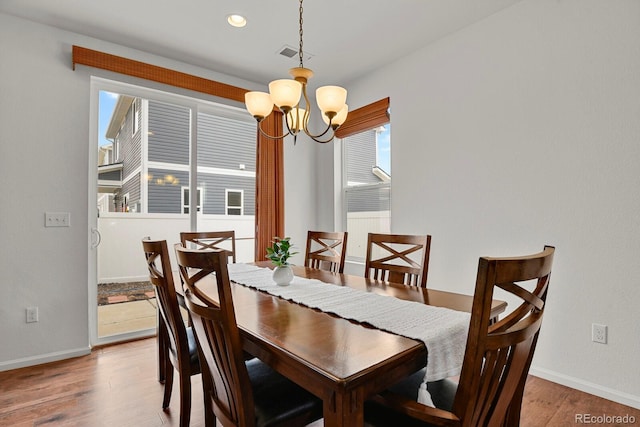 20826 Robins Dr, Denver, CO 80249 - dining area featuring a chandelier, baseboards, light wood-style floors, healthy amount of natural light, and recessed lighting