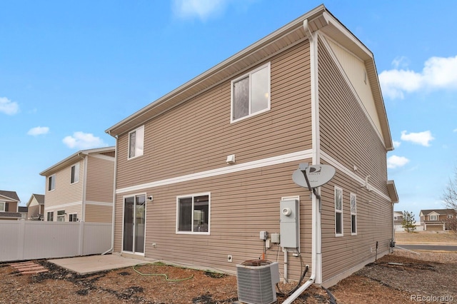 20826 Robins Dr, Denver, CO 80249 - rear view of house with central air condition unit and fence