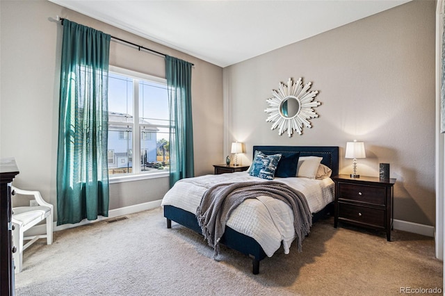 carpeted bedroom with baseboards