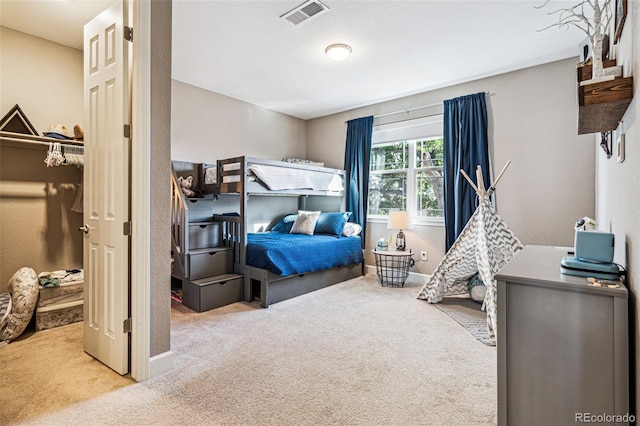 bedroom featuring carpet, visible vents, and baseboards