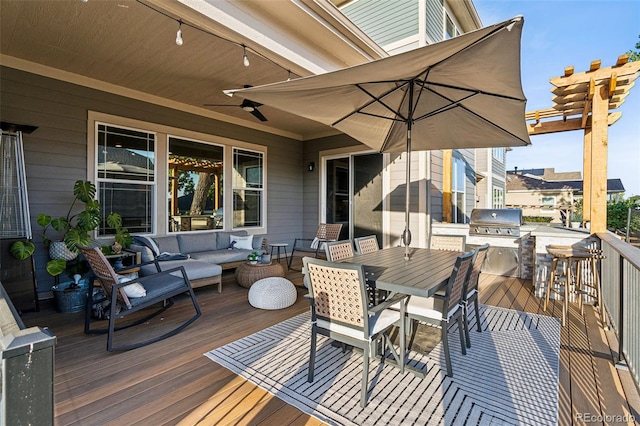 wooden terrace with outdoor dining area, outdoor lounge area, grilling area, ceiling fan, and exterior kitchen