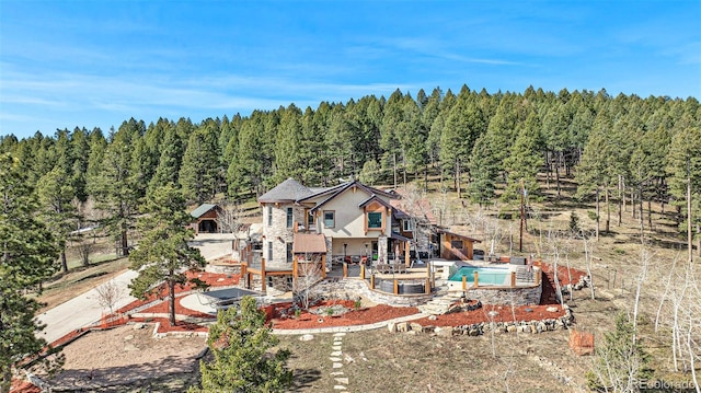 aerial view featuring a view of trees