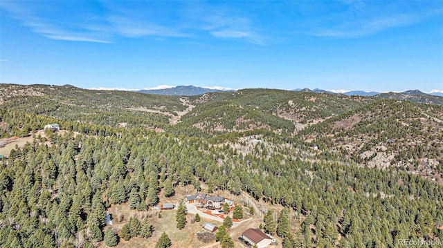 aerial view with a forest view and a mountain view