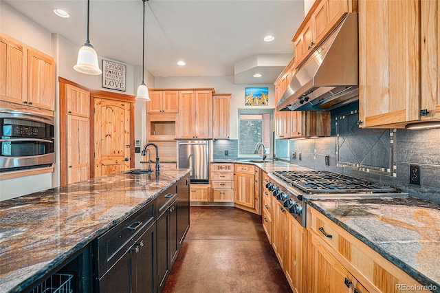 kitchen with a sink, appliances with stainless steel finishes, light brown cabinetry, and under cabinet range hood