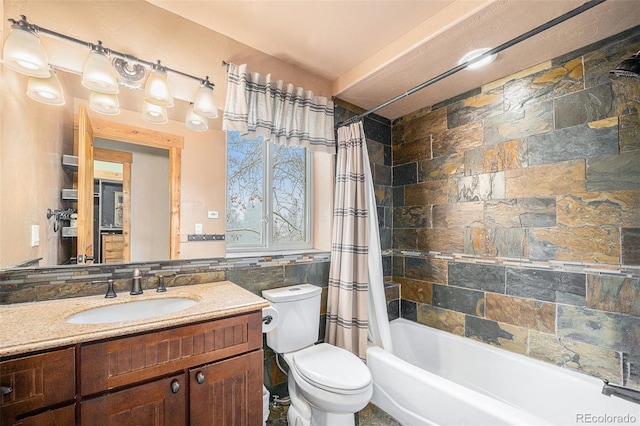 full bath featuring vanity, toilet, and shower / tub combo