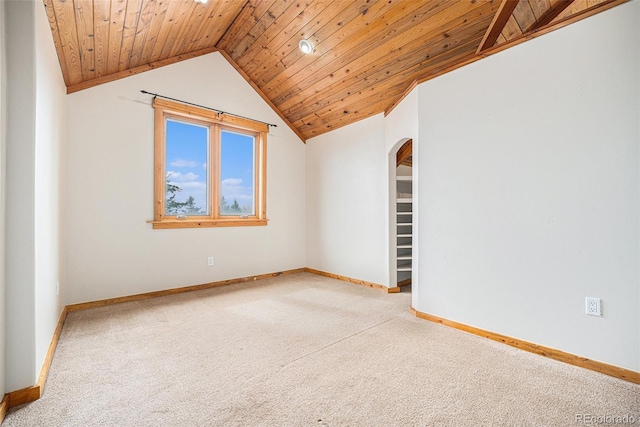interior space featuring arched walkways, baseboards, carpet flooring, and wood ceiling
