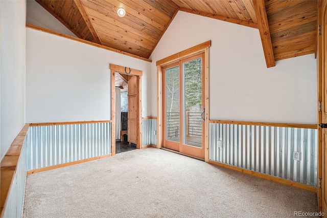 carpeted spare room with wood ceiling and lofted ceiling