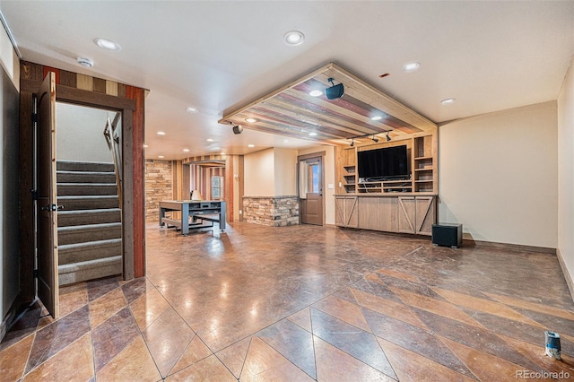 living area with recessed lighting, baseboards, and stairs
