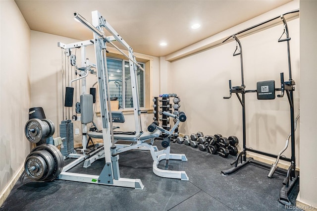 exercise room with recessed lighting and baseboards