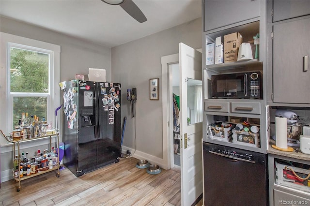 3764 N Raleigh St, Denver, CO 80212 - kitchen featuring black appliances, wood finished floors, a ceiling fan, and baseboards