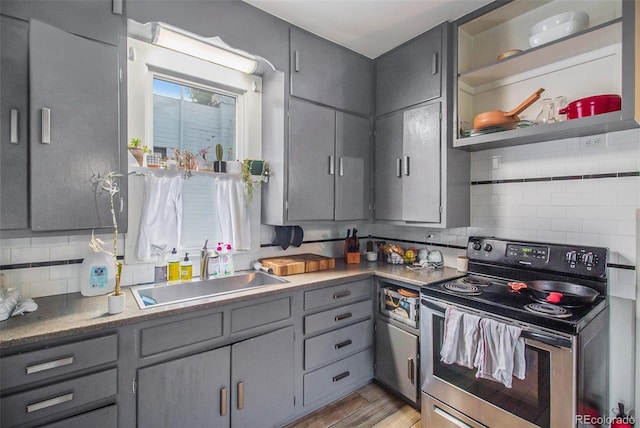 3764 N Raleigh St, Denver, CO 80212 - kitchen featuring stainless steel electric range, a sink, gray cabinets, and decorative backsplash