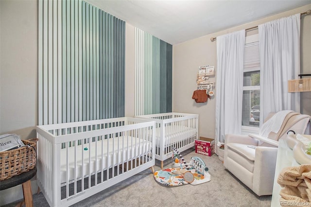 3764 N Raleigh St, Denver, CO 80212 - carpeted bedroom with wallpapered walls and a crib