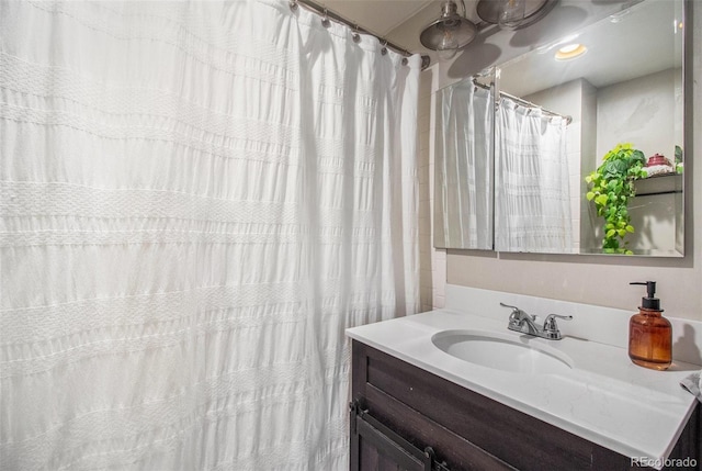 3764 N Raleigh St, Denver, CO 80212 - bathroom with vanity and a shower with shower curtain