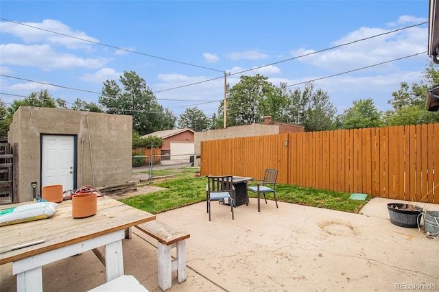 3764 N Raleigh St, Denver, CO 80212 - fenced backyard featuring outdoor dining area, a patio, and an outdoor structure