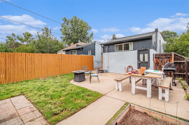 3764 N Raleigh St, Denver, CO 80212 - back of property featuring a fire pit, a patio, a shingled roof, and stucco siding