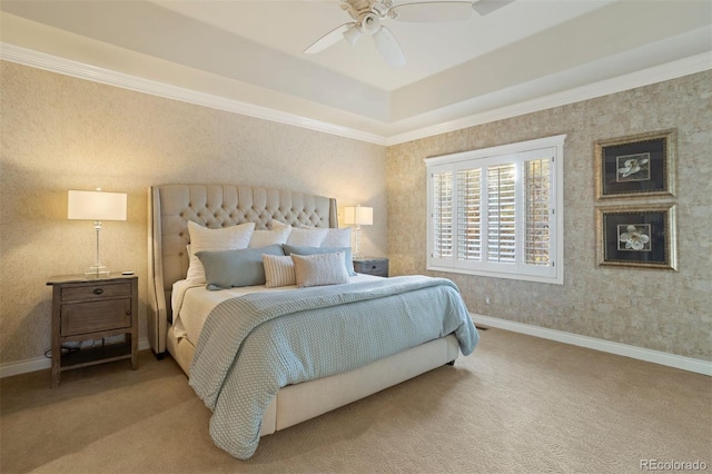 carpeted bedroom with crown molding and ceiling fan