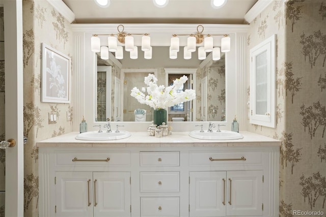 bathroom with vanity and ornamental molding