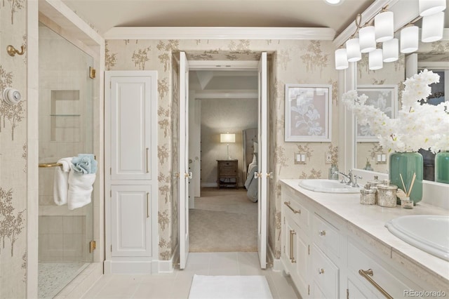 bathroom featuring vanity, crown molding, tile patterned flooring, and walk in shower