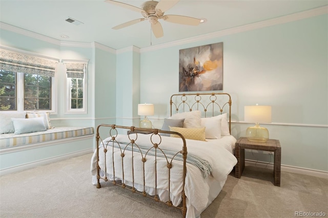 carpeted bedroom featuring ceiling fan and ornamental molding