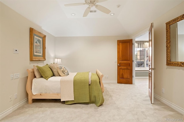 carpeted bedroom featuring ceiling fan and vaulted ceiling