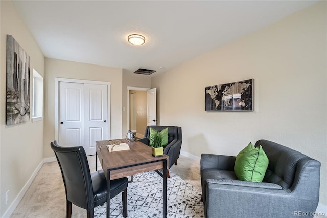 office space with visible vents, baseboards, and light colored carpet