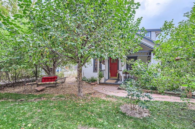 1580 Redwood Ave, Boulder, CO 80304 - view of front of house with covered porch and a front yard