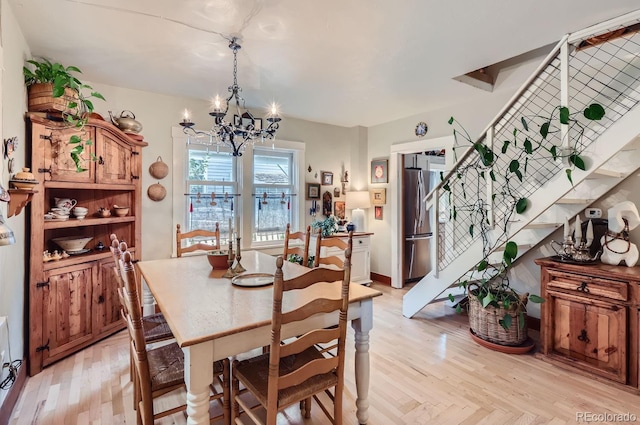 1580 Redwood Ave, Boulder, CO 80304 - dining room featuring a chandelier, stairway, and light wood-type flooring