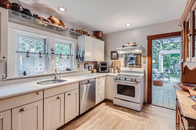 1580 Redwood Ave, Boulder, CO 80304 - kitchen with stainless steel dishwasher, electric stove, light countertops, and recessed lighting
