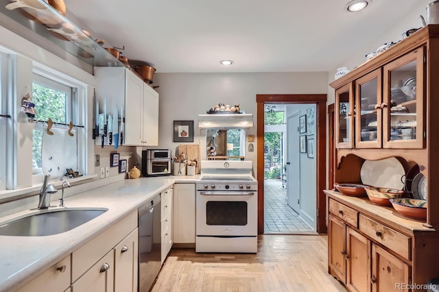1580 Redwood Ave, Boulder, CO 80304 - kitchen featuring white range with electric cooktop, stainless steel dishwasher, light countertops, plenty of natural light, and recessed lighting