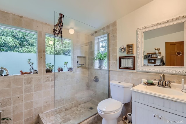 1580 Redwood Ave, Boulder, CO 80304 - bathroom with tile walls, vanity, and tiled shower