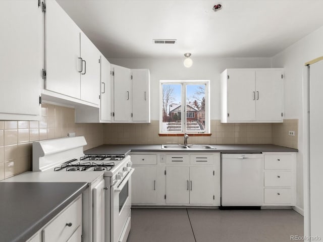 kitchen with sink, white cabinetry, white appliances, and tasteful backsplash