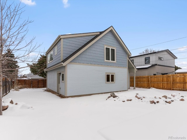 view of snow covered house