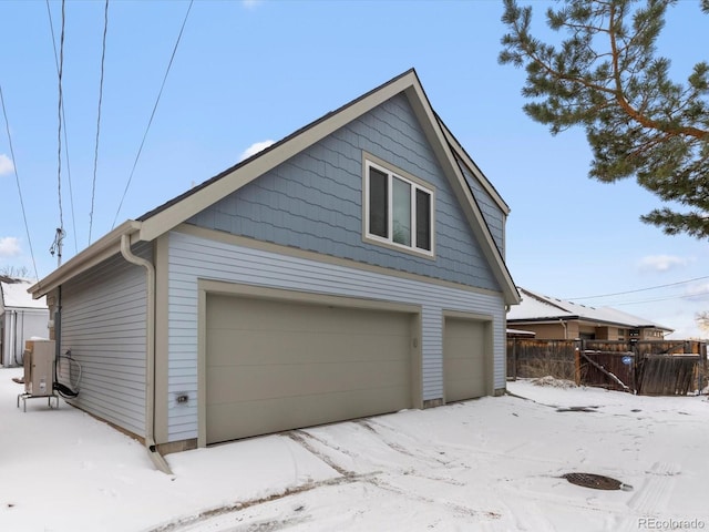 view of snow covered garage