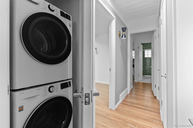 1338 S Fairfax St, Denver, CO 80222 - washroom with estacked washer and dryer and light wood-style floors