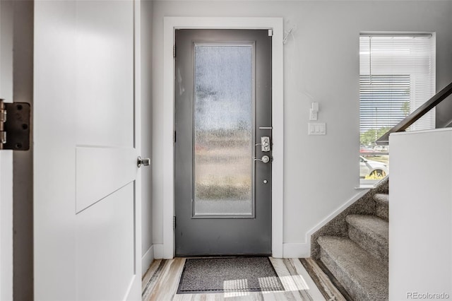 2922 W 26th Ave Unit 1, Denver, CO 80211 - foyer entrance featuring stairway and wood finished floors