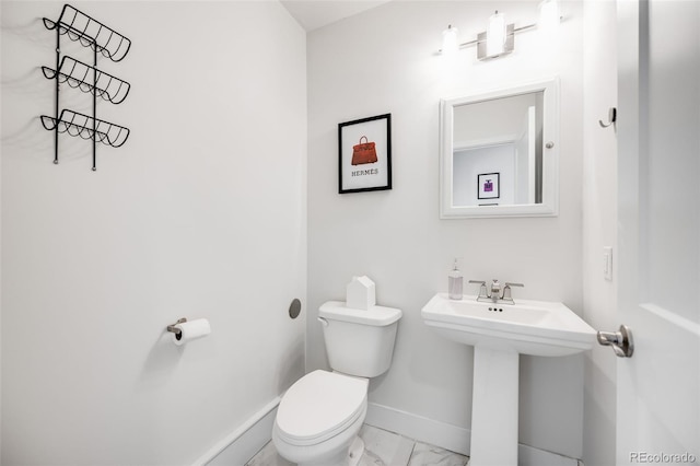 2922 W 26th Ave Unit 1, Denver, CO 80211 - half bathroom featuring toilet and marble look tiles