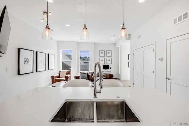 2922 W 26th Ave Unit 1, Denver, CO 80211 - kitchen featuring open floor plan, recessed lighting, decorative light fixtures, and light countertops