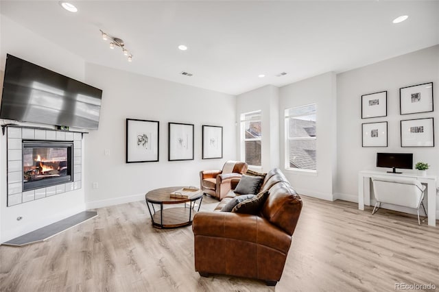 2922 W 26th Ave Unit 1, Denver, CO 80211 - living room featuring light wood-style floors, a fireplace, and recessed lighting