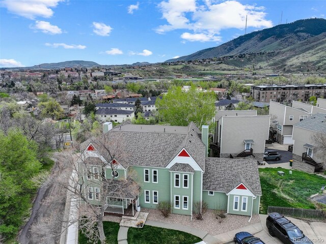 aerial perspective of suburban area featuring a mountain backdrop