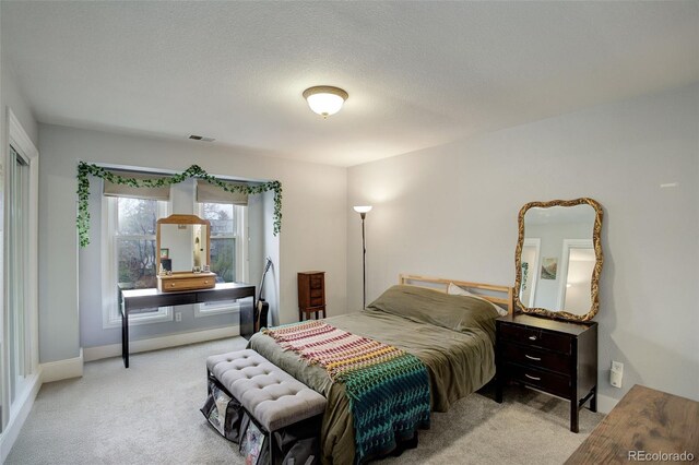carpeted bedroom featuring baseboards
