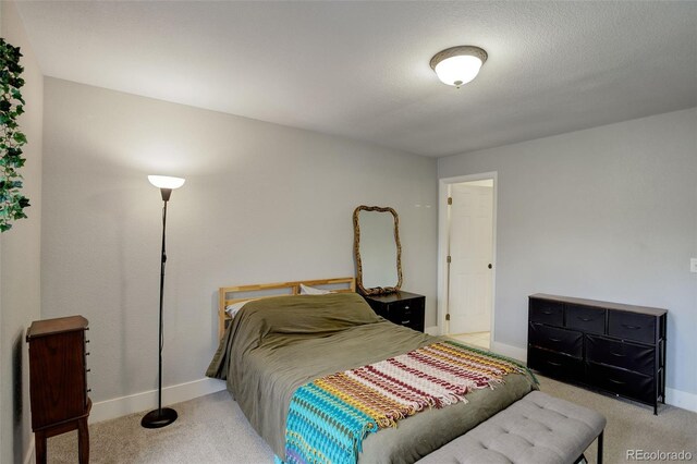 bedroom with carpet and baseboards